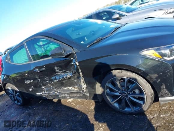 2019 Hyundai Veloster Premium z VIN KMHTG6AF7KU010854, wystawiony jako IAAI lot #41386268 z przebiegiem 87 133 mil mil oraz . Historia ofert i sprzedaży dostępna na DreamBid. Obrazek 13.