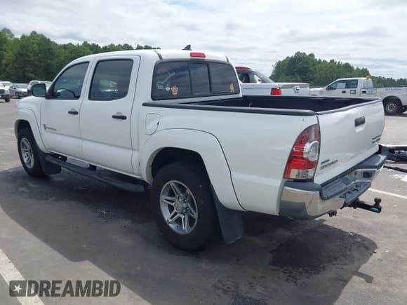 ✅ 2014 Toyota Tacoma PreRunner • VIN: 3TMJU4GN5EM161224 • Lot: 43179702. Listed on IAAI with 148,222 mi. Free auction sales archive from the USA and detailed vehicle history report at DreamBid. Image 3.