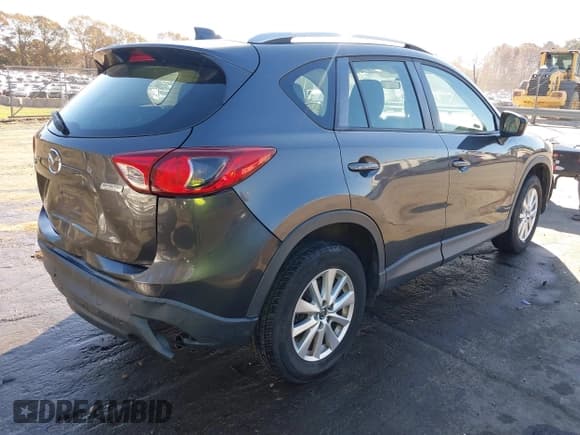 ✅ 2014 Mazda CX-5 Sport • VIN: JM3KE2BE0E0339810 • Lot: 43657362. Listed on IAAI with 198,849 mi. Free auction sales archive from the USA and detailed vehicle history report at DreamBid. Image 4.