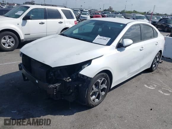 ✅ 2021 Kia Forte LXS • VIN: 3KPF24AD3ME299221 • Lot: 41893062. Listed on IAAI with 62,961 mi. Free auction sales archive from the USA and detailed vehicle history report at DreamBid. Image 2.
