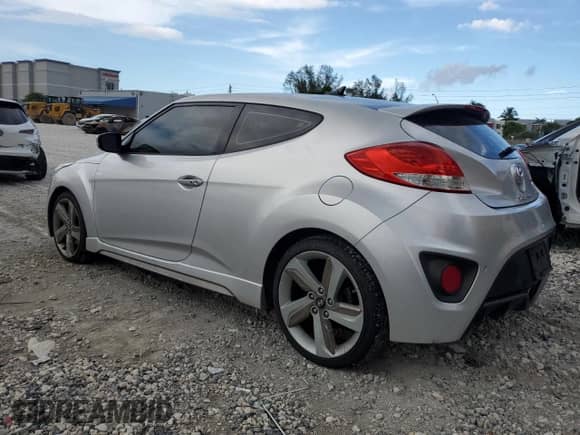 2013 Hyundai Veloster Turbo z VIN KMHTC6AE8DU123217, wystawiony jako Copart lot #69754965 z przebiegiem 11 088 mil mil oraz Czysty tytuł • Clean title. Historia ofert i sprzedaży dostępna na DreamBid. Obrazek 2.