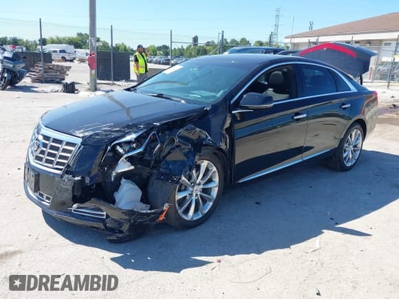 ✅ 2013 Cadillac XTS Premium • VIN: 2G61T5S33D9116128 • Lot: 43072711. Listed on IAAI with 50,267 mi. Free auction sales archive from the USA and detailed vehicle history report at DreamBid. Image 2.
