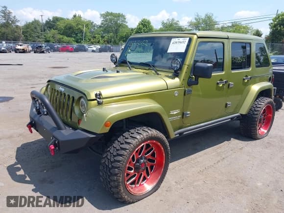 ✅ 2007 Jeep Wrangler Unlimited Sahara • VIN: 1J4GA59117L118162 • Lot: 42835652. Listed on IAAI with 199,208 mi. Free auction sales archive from the USA and detailed vehicle history report at DreamBid. Image 2.