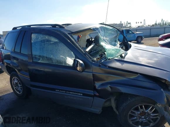 ✅ 2004 Jeep Grand Cherokee Laredo • VIN: 1J4GX48S84C401673 • Lot: 43657580. Listed on IAAI with Not provided. Free auction sales archive from the USA and detailed vehicle history report at DreamBid. Image 13.