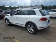 ✅ 2013 Volkswagen Touareg Lux • VIN: WVGEF9BP4DD013167 • Lot: 60422255. Listed on Copart with 157,319 mi. Free auction sales archive from the USA and detailed vehicle history report at DreamBid. Image 2.