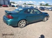 ✅ 1999 Pontiac Grand Am SE1 • VIN: 1G2NE52E6XC503882 • Lot: 64674975. Listed on Copart with 122,813 mi. Free auction sales archive from the USA and detailed vehicle history report at DreamBid. Image 3.