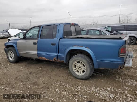 2002 Dodge Dakota Sport z VIN 1B7HL38X62S686016, wystawiony jako Copart lot #52917944 z przebiegiem 268 964 mil mil oraz Szkoda całkowita • Salvage title. Historia ofert i sprzedaży dostępna na DreamBid. Obrazek 2.