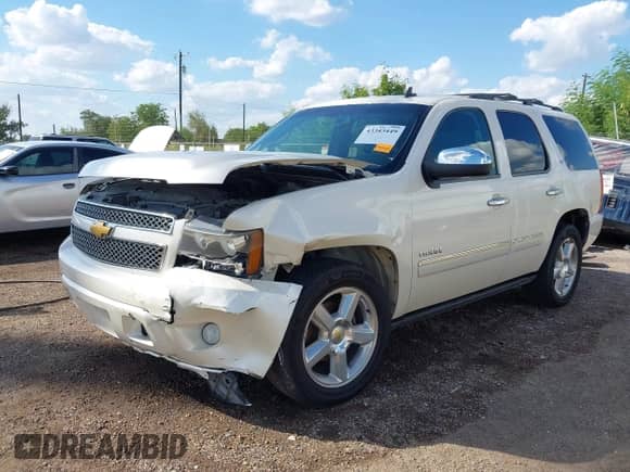 2013 Chevrolet Tahoe LTZ with VIN 1GNSCCE09DR357731, listed as a IAAI auction lot 43343449 with 148,667 mi miles and . Bid and sale history available at DreamBid. Image 2.