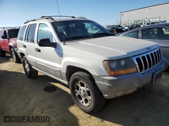 ✅ 1999 Jeep Grand Cherokee Laredo • VIN: 1J4GW58N8XC736438 • Лот: 88605625. Опубликован ранее на Copart с пробегом 181 612 миль. Бесплатный доступ к архиву аукционных продаж из США и подробный отчёт об истории автомобиля на DreamBid. Изображение 4.