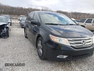 ✅ 2012 Honda Odyssey Touring • VIN: 5FNRL5H97CB087058 • Lot: 43807667. Listed on IAAI with 302,902 mi. Free auction sales archive from the USA and detailed vehicle history report at DreamBid. Image 1.