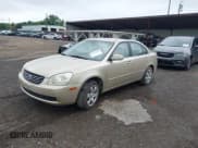 ✅ 2006 Kia Optima LX • VIN: KNAGE123765040596 • Lot: 42759344. Listed on IAAI with 177,890 mi. Free auction sales archive from the USA and detailed vehicle history report at DreamBid. Image 2.