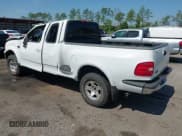 ✅ 1999 Ford F-150 • VIN: 2FTRX08W0XCA56180 • Lot: 42865592. Listed on IAAI with 203,986 mi. Free auction sales archive from the USA and detailed vehicle history report at DreamBid. Image 3.