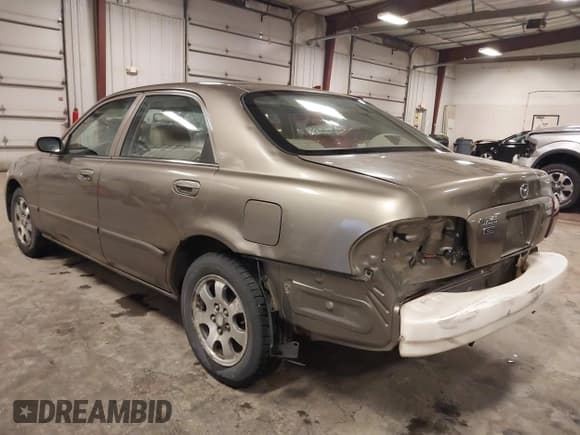 ✅ 2000 Mazda 626 LX • VIN: 1YVGF22C5Y5122894 • Lot: 42183386. Listed on IAAI with 154,888 mi. Free auction sales archive from the USA and detailed vehicle history report at DreamBid. Image 3.