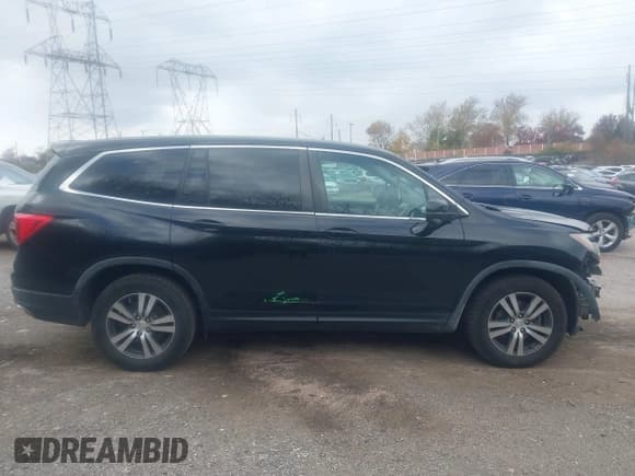 ✅ 2017 Honda Pilot EX-L • VIN: 5FNYF6H55HB062267 • Lot: 43680104. Listed on IAAI with 119,797 mi. Free auction sales archive from the USA and detailed vehicle history report at DreamBid. Image 14.