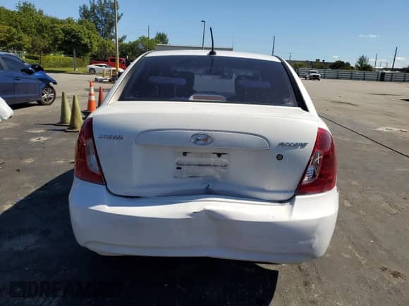 2010 Hyundai Accent GLS with VIN KMHCN4AC0AU494560, listed as a Copart auction lot 90856845 with 123,645 mi miles and Salvage title. Bid and sale history available at DreamBid. Image 6.
