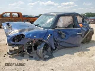 2014 MINI Hardtop S with VIN WMWXM7C59ET970306, listed as a Copart auction lot 70354045 with 150,111 mi miles and Salvage title. Bid and sale history available at DreamBid. Image 1.