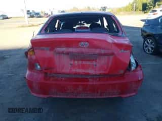 2005 Hyundai Accent GLS with VIN KMHCG35C65U348300, listed as a Copart auction lot 77847614 with 141,102 mi miles and Salvage title. Bid and sale history available at DreamBid. Image 6.