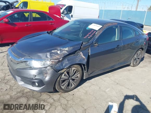 ✅ 2018 Honda Civic EX-T • VIN: JHMFC1F34JX008280 • Lot: 43809009. Listed on IAAI with 122,246 mi. Free auction sales archive from the USA and detailed vehicle history report at DreamBid. Image 2.