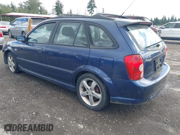 ✅ 2003 Mazda Protege • VIN: JM1BJ245031117566 • Lot: 42349853. Wystawiony na IAAI z przebiegiem 152 784 mil. Bezpłatny archiwum sprzedaży aukcyjnych z USA i szczegółowy raport historii pojazdu na DreamBid. Zdjęcie 3.