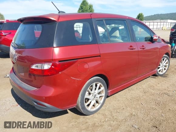 ✅ 2013 Mazda 5 Touring • VIN: JM1CW2CL5D0150270 • Lot: 42696073. Listed on IAAI with 98,715 mi. Free auction sales archive from the USA and detailed vehicle history report at DreamBid. Image 4.