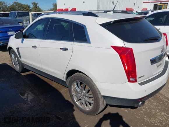 ✅ 2014 Cadillac SRX Performance Collection • VIN: 3GYFNCE37ES631757 • Lot: 43593230. Listed on IAAI with 104,628 mi. Free auction sales archive from the USA and detailed vehicle history report at DreamBid. Image 3.