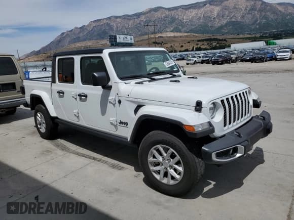 ✅ 2023 Jeep Gladiator Sport S • VIN: 1C6HJTAG9PL582791 • Lot: 63684225. Listed on Copart with 21,958 mi. Free auction sales archive from the USA and detailed vehicle history report at DreamBid. Image 4.