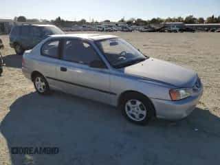 2002 Hyundai Accent with VIN KMHCF35G62U203274, listed as a Copart auction lot 77047834 with 90,442 mi miles and Salvage title. Bid and sale history available at DreamBid. Image 4.