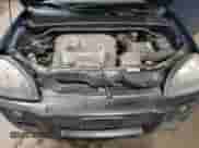 2005 Hyundai Tucson GLS z VIN KM8JN72D15U141766, wystawiony jako Copart lot #80990424 z przebiegiem 158 819 mil mil oraz Szkoda całkowita • Salvage title. Historia ofert i sprzedaży dostępna na DreamBid. Obrazek 12.