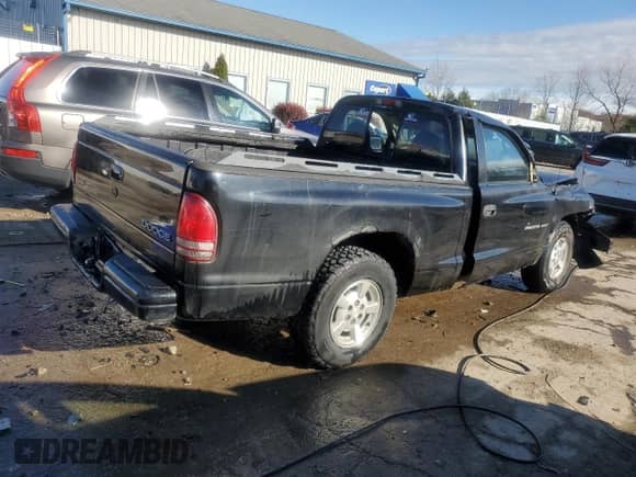 2002 Dodge Dakota Sport z VIN 1B7FL36XX2S643163, wystawiony jako Copart lot #80643184 z przebiegiem 230 990 mil mil oraz Nie do naprawy • Non repairable. Historia ofert i sprzedaży dostępna na DreamBid. Obrazek 3.