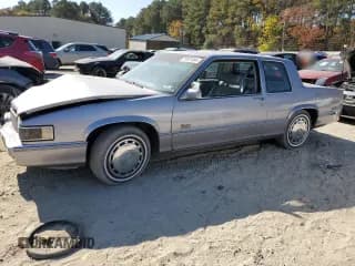 ✅ 1990 Cadillac DeVille • VIN: 1G6CD1339L4358825 • Lot: 76901884. Listed on Copart with 169,956 mi. Free auction sales archive from the USA and detailed vehicle history report at DreamBid. Image 1.
