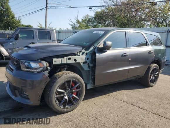 2018 Dodge Durango SRT z VIN 1C4SDJGJ2JC169843, wystawiony jako Copart lot #71884965 z przebiegiem Nie podano mil oraz Czysty tytuł • Clean title. Historia ofert i sprzedaży dostępna na DreamBid. Obrazek 1.