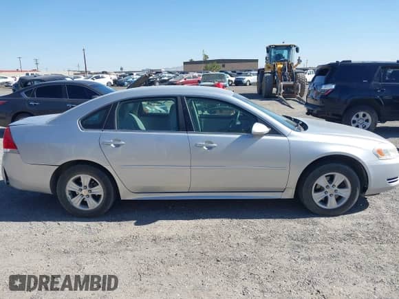 2013 Chevrolet Impala LS z VIN 2G1WF5E35D1265220, wystawiony jako IAAI lot #42559869 z przebiegiem 124 046 mil mil oraz . Historia ofert i sprzedaży dostępna na DreamBid. Obrazek 13.