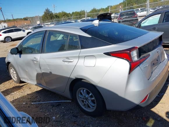 ✅ 2021 Toyota Prius L Eco • VIN: JTDKAMFU9M3143122 • Lot: 43486623. Listed on IAAI with 81,483 mi. Free auction sales archive from the USA and detailed vehicle history report at DreamBid. Image 14.