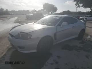 ✅ 2006 Hyundai Tiburon GS • VIN: KMHHM65D76U222358 • Лот: 64834055. Опубликован ранее на Copart с пробегом 129 477 миль. Бесплатный доступ к архиву аукционных продаж из США и подробный отчёт об истории автомобиля на DreamBid. Изображение 1.