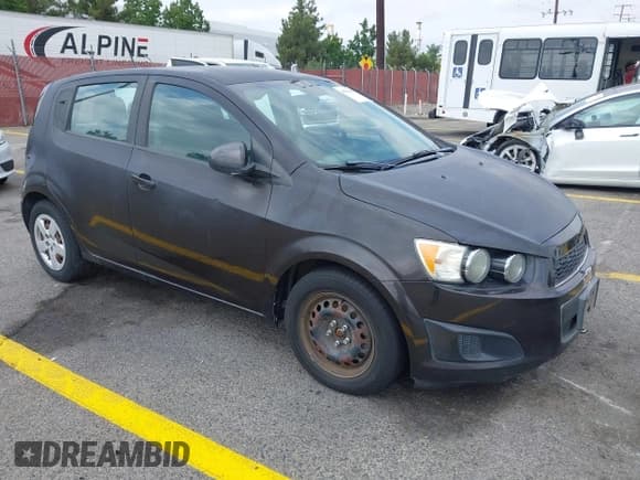 ✅ 2013 Chevrolet Sonic LS • VIN: 1G1JA6SG3D4239239 • Lot: 43304489. Listed on IAAI with 100,388 mi. Free auction sales archive from the USA and detailed vehicle history report at DreamBid. Image 1.