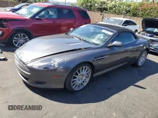 ✅ 2006 Aston Martin DB9 • VIN: SCFAD02A76GB04679 • Lot: 69600825. Wystawiony na Copart z przebiegiem 34 740 mil. Bezpłatny archiwum sprzedaży aukcyjnych z USA i szczegółowy raport historii pojazdu na DreamBid. Zdjęcie 1.