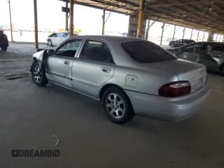 ✅ 2002 Mazda 626 LX • VIN: 1YVGF22C425273491 • Lot: 44626465. Listed on Copart with 147,591 mi. Free auction sales archive from the USA and detailed vehicle history report at DreamBid. Image 2.