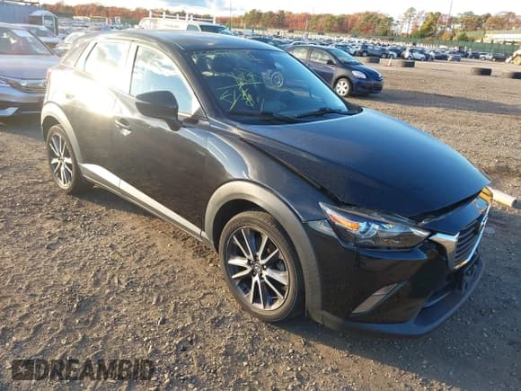 ✅ 2018 Mazda CX-3 Touring • VIN: JM1DKFC71J0332618 • Lot: 43587481. Listed on IAAI with 48,473 mi. Free auction sales archive from the USA and detailed vehicle history report at DreamBid. Image 1.