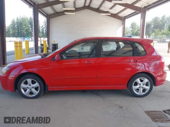 ✅ 2009 Kia Spectra Spectra5 • VIN: KNAFE241595023877 • Lot: 42583449. Listed on IAAI with 160,843 mi. Free auction sales archive from the USA and detailed vehicle history report at DreamBid. Image 15.