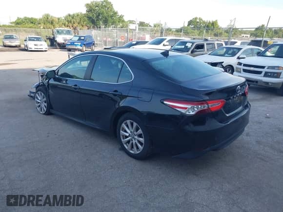 2019 Toyota Camry LE z VIN 4T1B11HK7KU258086, wystawiony jako IAAI lot #42436658 z przebiegiem 130 729 mil mil oraz . Historia ofert i sprzedaży dostępna na DreamBid. Obrazek 3.