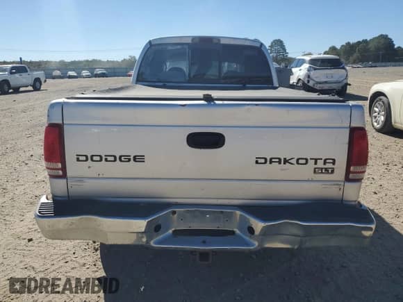 2003 Dodge Dakota SLT z VIN 1D7HL48X33S340079, wystawiony jako Copart lot #76516514 z przebiegiem 295 350 mil mil oraz Czysty tytuł • Clean title. Historia ofert i sprzedaży dostępna na DreamBid. Obrazek 6.