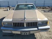 ✅ 1986 Pontiac Parisienne • VIN: 1G2BT69Y2GX267691 • Lot: 79337604. Listed on Copart with 55,458 mi. Free auction sales archive from the USA and detailed vehicle history report at DreamBid. Image 5.