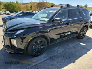 2023 Hyundai Palisade XRT с VIN KM8R3DGE9PU489455, выставлен на аукционе Copart как лот 80909565 с пробегом 27 504 миль миль и Списание • Salvage title. История ставок и продаж доступна на DreamBid. Изображение 1.