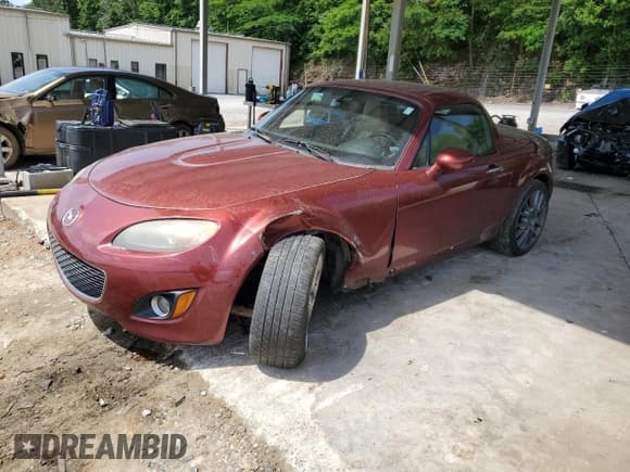 ✅ 2012 Mazda MX-5 Miata Grand Touring • VIN: JM1NC2PF2C0221297 • Lot: 57167885. Listed on Copart with 175,223 mi. Free auction sales archive from the USA and detailed vehicle history report at DreamBid. Image 1.