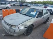 ✅ 1999 Toyota Corolla VE • VIN: 1NXBR12E2XZ214726 • Lot: 43005806. Listed on IAAI with 295,368 mi. Free auction sales archive from the USA and detailed vehicle history report at DreamBid. Image 2.