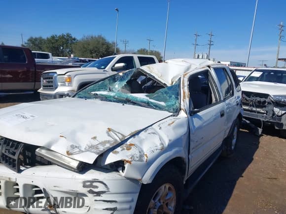 ✅ 2004 Isuzu Rodeo S • VIN: 4S2CK58W944315203 • Lot: 41355461. Listed on IAAI with Not provided. Free auction sales archive from the USA and detailed vehicle history report at DreamBid. Image 6.
