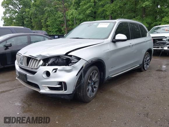 ✅ 2017 BMW X5 xDrive40e • VIN: 5UXKT0C53H0S80157 • Lot: 42223436. Listed on IAAI with 100,209 mi. Free auction sales archive from the USA and detailed vehicle history report at DreamBid. Image 2.