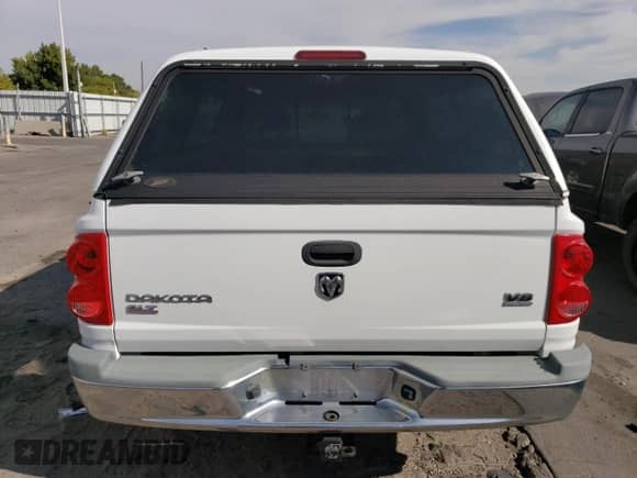 2005 Dodge Dakota SLT с VIN 1D7HW42N15S346853, выставлен на аукционе Copart как лот 75860094 с пробегом 182 727 миль миль и Списание • Salvage title. История ставок и продаж доступна на DreamBid. Изображение 6.
