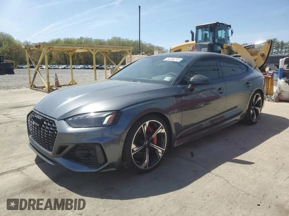 ✅ 2023 Audi RS 5 Sportback • VIN: WUAAWCF55PA902979 • Лот: 54194715. Опубликован ранее на Copart с пробегом 9 576 миль. Бесплатный доступ к архиву аукционных продаж из США и подробный отчёт об истории автомобиля на DreamBid. Изображение 1.