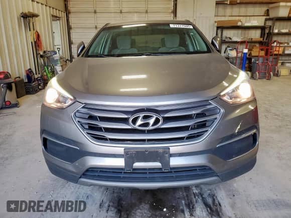 2018 Hyundai Santa Fe 2.4L with VIN 5NMZT3LB0JH081208, listed as a Copart auction lot 71311505 with 147,017 mi miles and Salvage title. Bid and sale history available at DreamBid. Image 5.